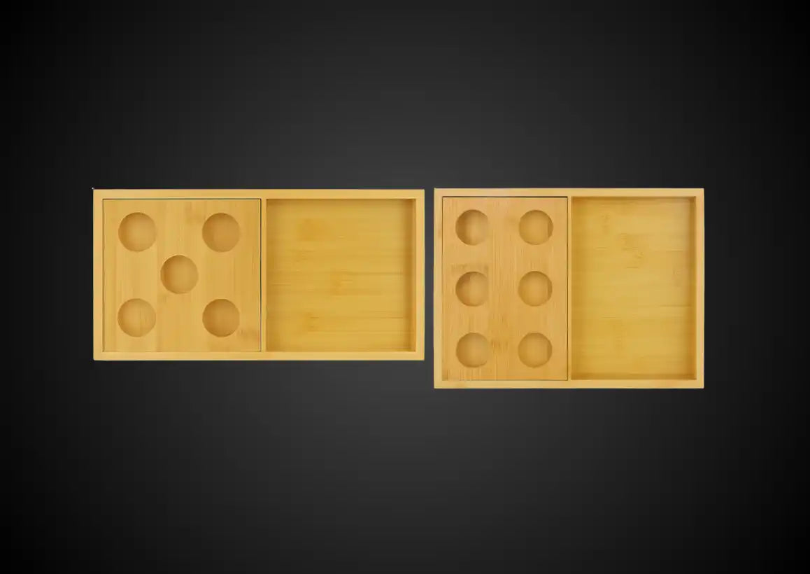 Two light-colored wooden boxes with circular compartments.