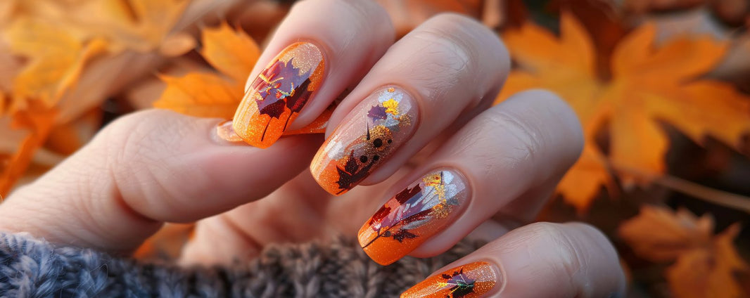 Autumn nail art with orange and brown gradient and maple leaf designs