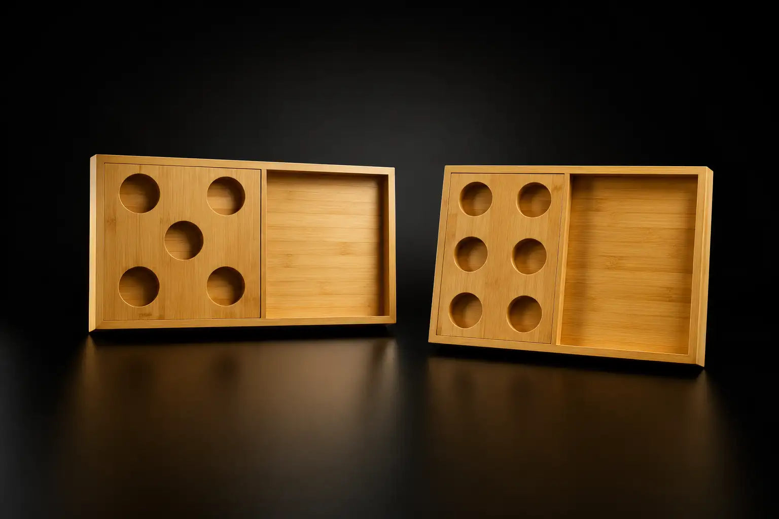 Two light brown bamboo serving trays, each with a sliding compartment and circular cutouts for holding items.